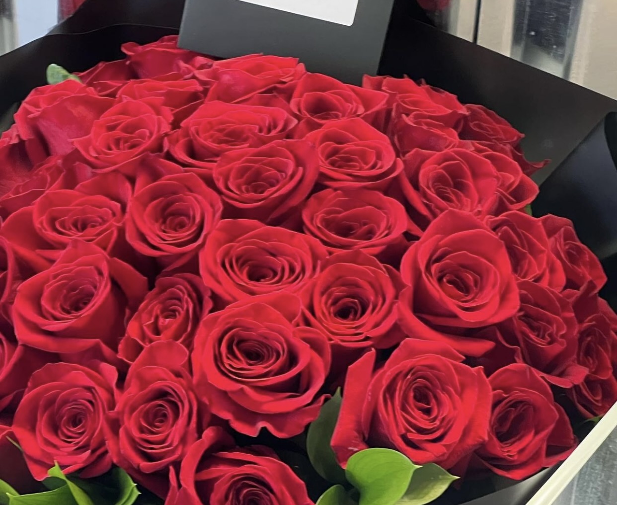 Bouquet of red roses in a black box for flower delivery in Miami from a Miami Beach flower shop