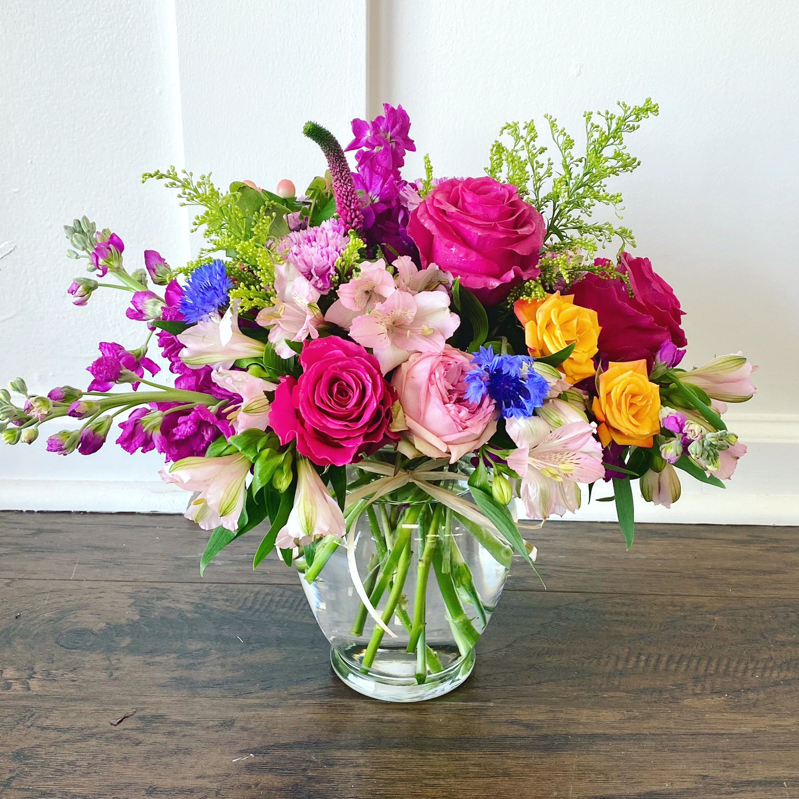 Send colorful bouquet of flowers to Miami Beach for same-day flower delivery. Designed in clear glass vase with roses, alstroemeria, solidago, cornflower, Veronica, stock flower, etc.