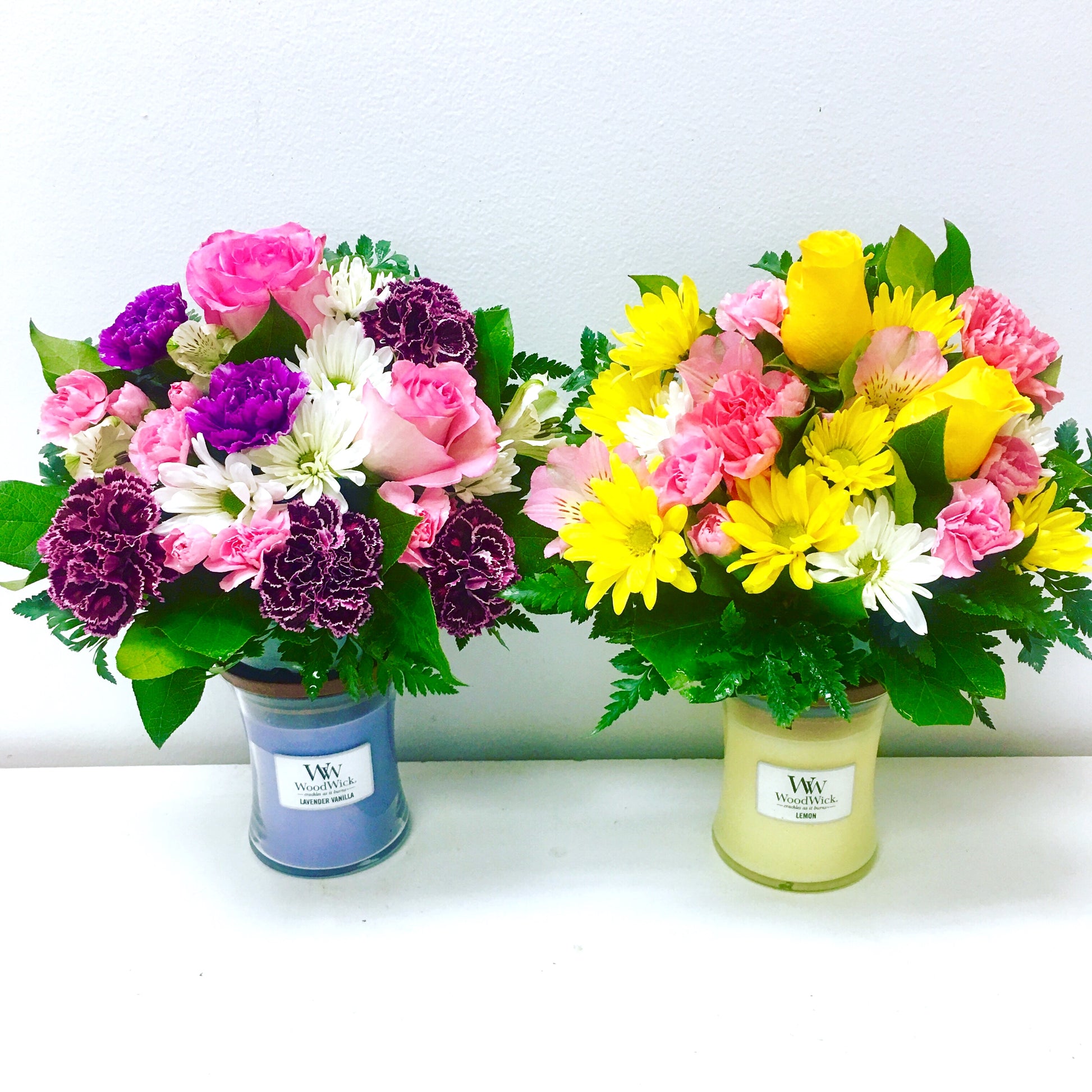 Two flower bouquets in candles on a white background for flower delivery in Miami