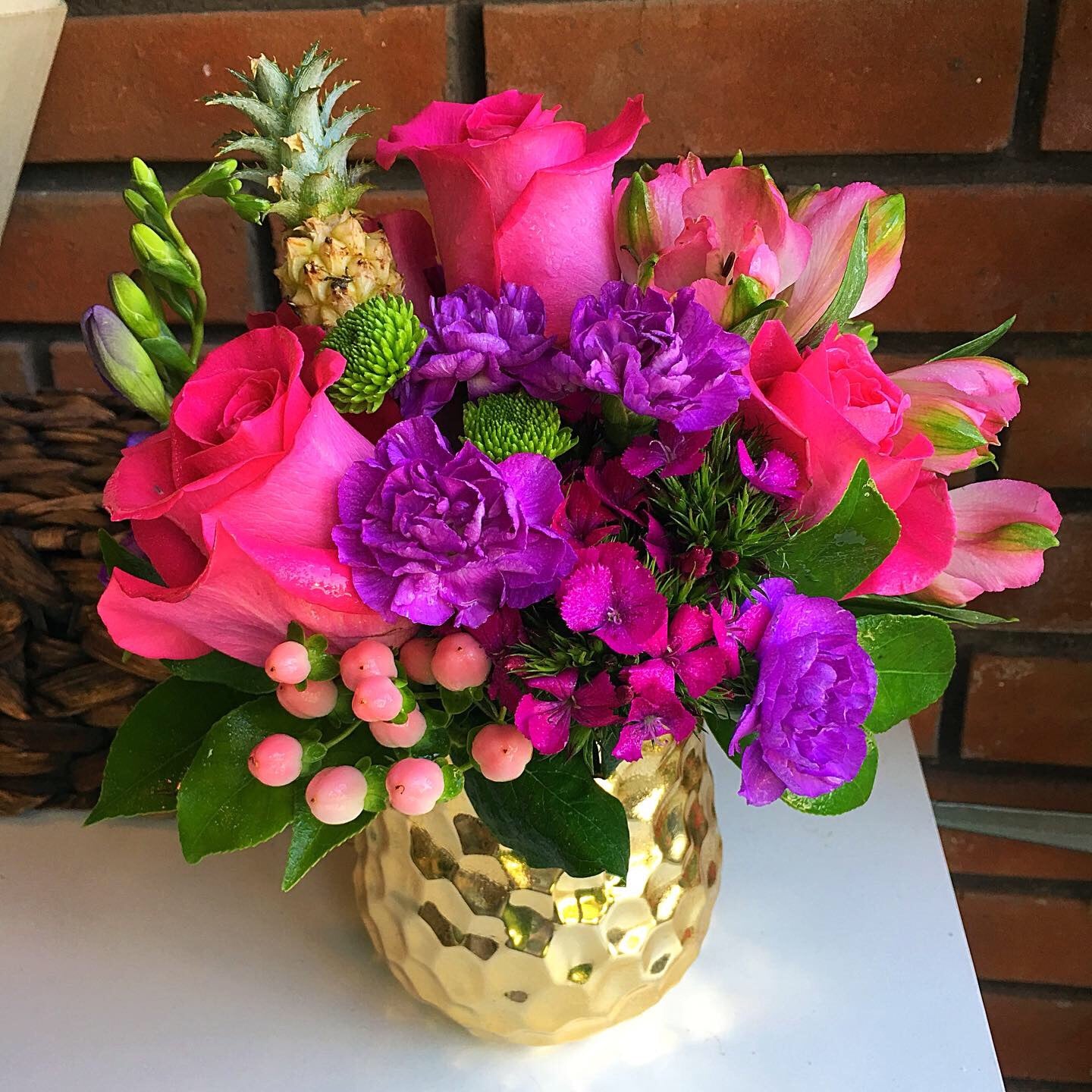Pembroke Pines florist bouquet for delivery from flower shop in Pembroke Pines. Colorful pink and purple flowers in gold metallic container with pink berries