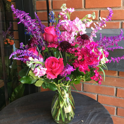 Colorful floral arrangement in front of a brick wall in Homestead from this Miami Florist